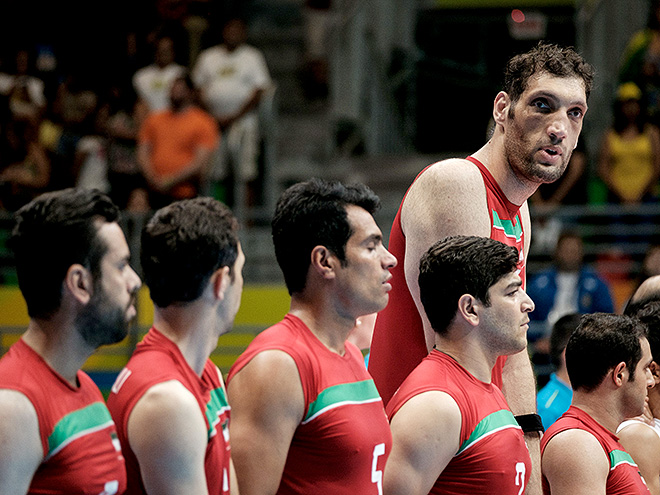 Iran's tallest sitting volleyball player Morteza Mehrzadselakjani stands with teammates before a preliminary match against Ukraine in the Paralympic Games at Riocentro in Rio de Janeiro on September 14, 2016. / AFP / YASUYOSHI CHIBA (Photo credit should read YASUYOSHI CHIBA/AFP/Getty Images)