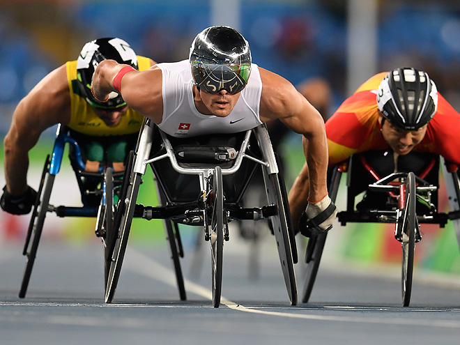Athletes compete in the men's preliminary 1500m wheelchair race at the Olympic Stadium during the Paralympic Games in Rio de Janeiro, Brazil on September 12, 2016. / AFP / CHRISTOPHE SIMON (Photo credit should read CHRISTOPHE SIMON/AFP/Getty Images)