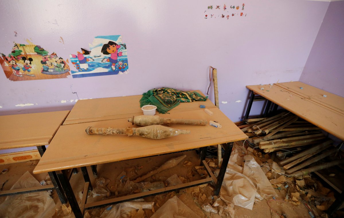 rocket-propelled-grenades-are-stacked-at-a-school-following-clashes-in-fallujah