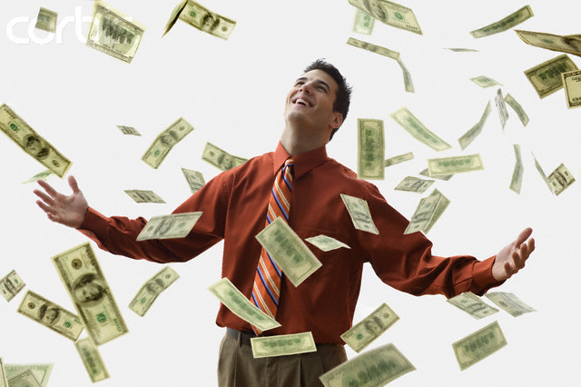 Money Falling on Happy Businessman --- Image by © JLP/Jose L. Pelaez/Corbis