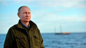 l_russian_president_vladimir_putin_looks_on_during_a_tour_on_lake_ilmen_in_novgorod_region_r-mr-w750