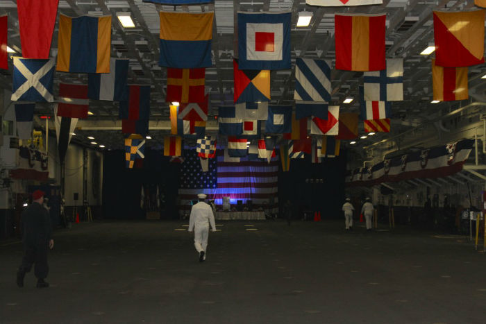 above-the-well-deck-is-the-kearsarges-hanger-bay-where-aircraft-are-stored-and-maintenance-is-done-it-is-also-used-by-the-crew-for-ceremonies-and-gatherings--and-when-needed-calisthenics-w700