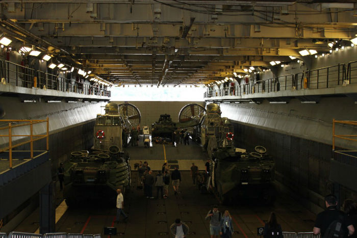 the-lower-section-of-the-well-deck-seen-here-loaded-with-amphibious-vehicles-and-a-landing-craft-air-cushion-can-be-ballasted-with-up-to-10-feet-of-water-allowing-landing-craft-to-enter-and-exit-w700