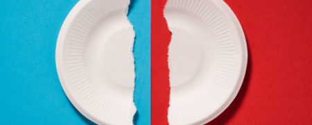 Torned Broken Paper Plates on Blue and Red Background.