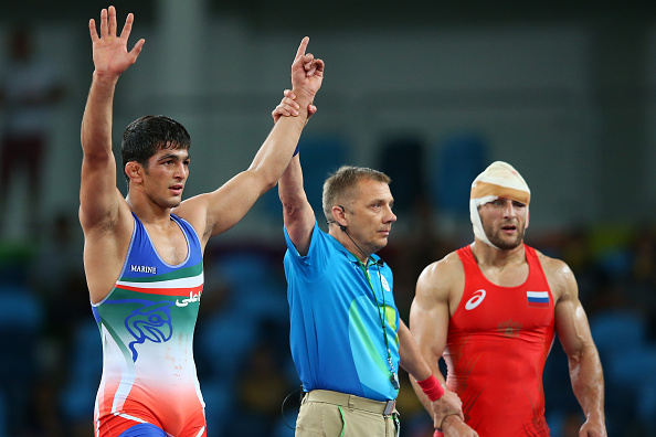 RIO DE JANEIRO, BRAZIL - AUGUST 19:  Aniuar Geduev of Russia looks on as Hassan Aliazam Yazdanicharati of the Islamic Republic of Iran celebrates during the Men's 74kg Gold Medal Wrestling match on Day 14 of the Rio 2016 Olympic Games at Carioca Arena 2 on August 19, 2016 in Rio de Janeiro, Brazil.  (Photo by Alex Livesey/Getty Images)