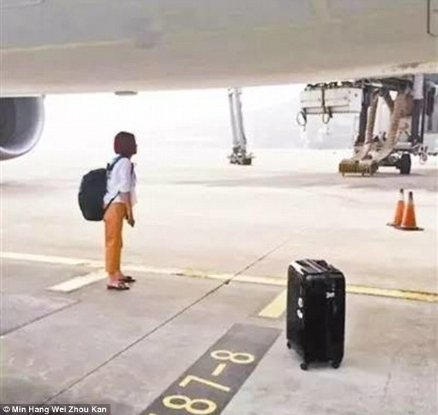 یک زن چینی، قصد متوقف کردن هواپیما در باند فرودگاه را داشت
