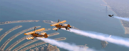 بر فراز دبی؛ حرکات نمایشی بسیار زیبای جت پک سواران و هواپیما ها در کنار هم [تماشا کنید]