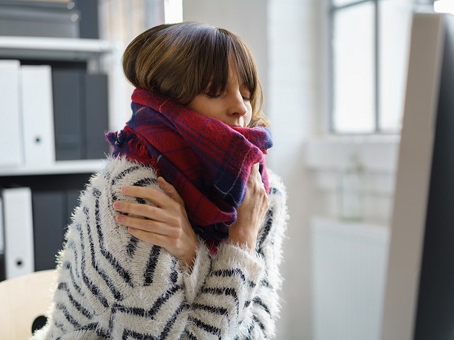 6Cold-weather-woman-at-desk-in-sweater-and-scarf.jpg