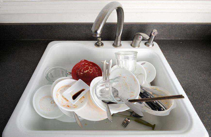 11 Leave dirty dishes in sink istock edit