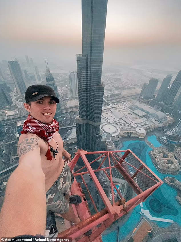 صعود دلهره آور به بلندترین جرثقیل دبی و آویزان شدن از یک دست + ویدیو