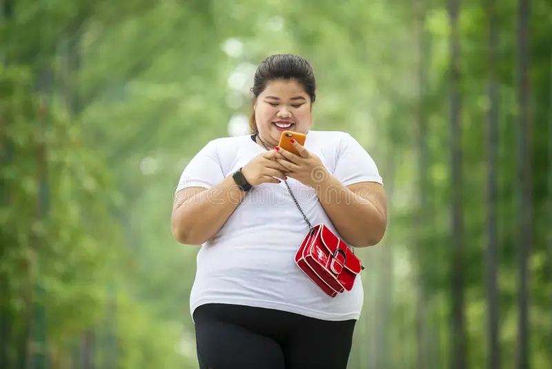 overweight woman using phone park picture looks happy mobile 147433724