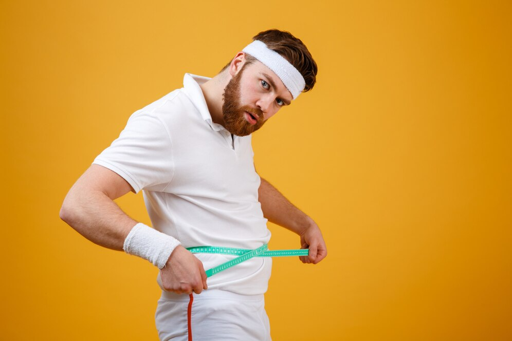 portrait sports man measuring his waist with tape 171337 15818